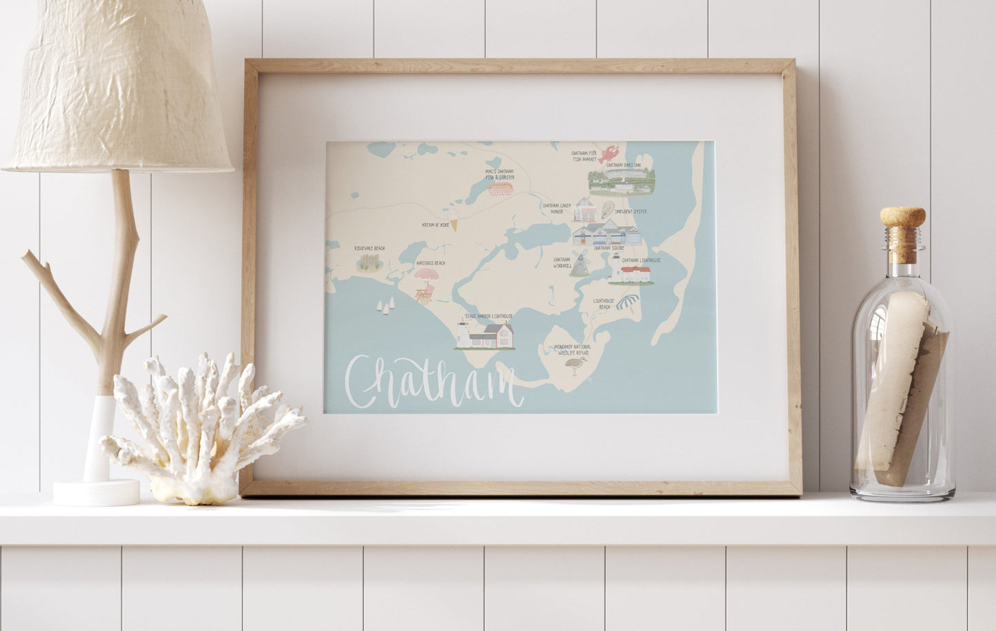 Framed map of Chatham on a shelf with decorative items